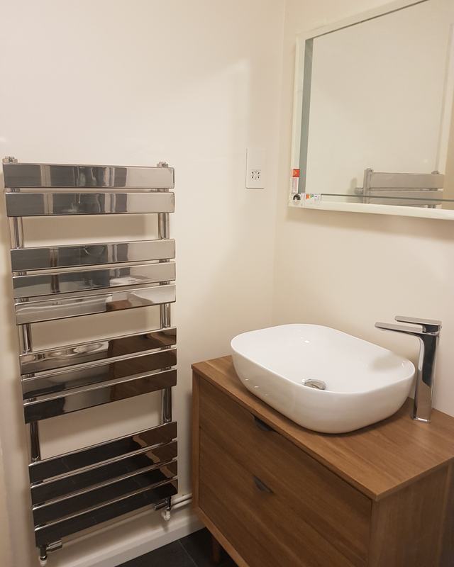 New basin, vanity and towel radiator