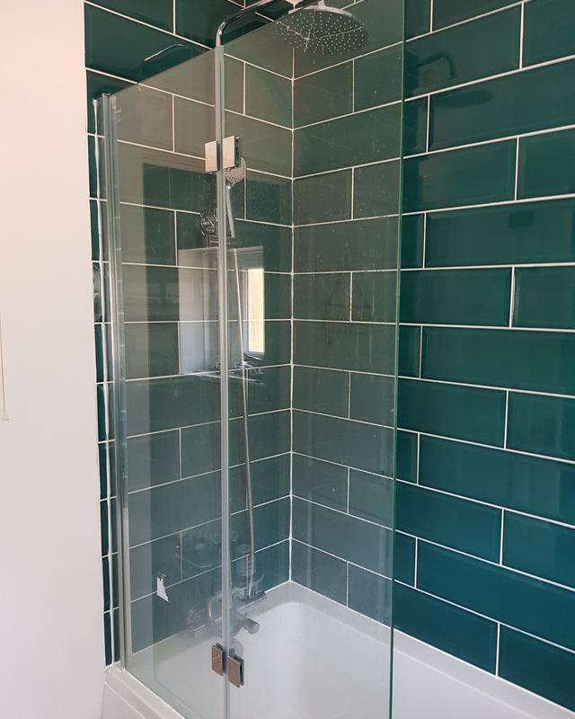 A dated green bathroom brought up to date