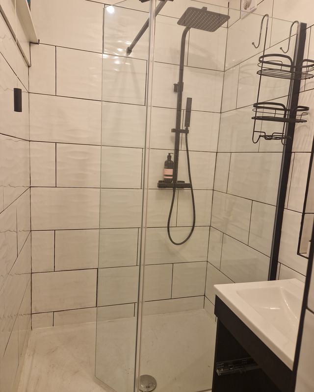White tiled shower over bath, Worthing